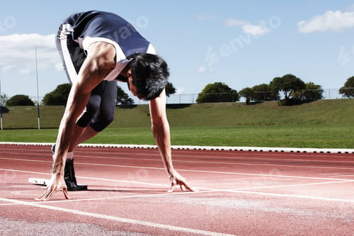 Preview: Ready to win this race. A young runner at the starting line.
