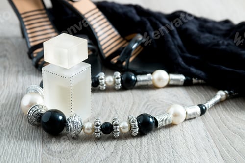Preview: Women outfit. Black lace dress, shoe sandals, necklace and perfume