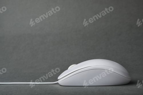 Preview: Modern wired computer mouse on grey background. Space for text