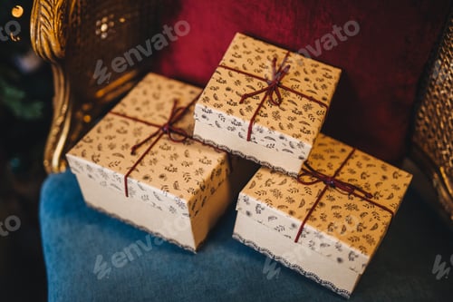 Preview: Wrapped gift boxes lie on armchair. Prepared surprise on birthday or some other holiday