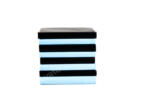 Preview: Stack of black and blue books isolated on white