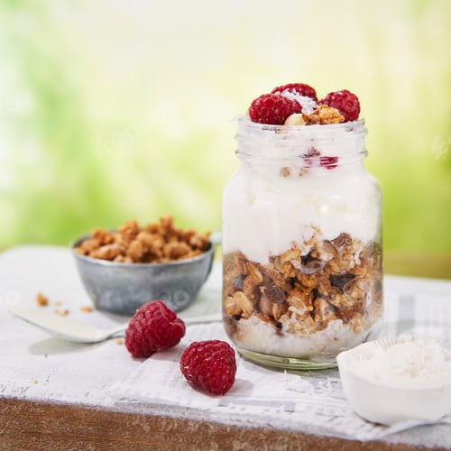 Preview: Food Banner background, Granola with greek yogurt parfait fresh raspberries, coconut in a glass.