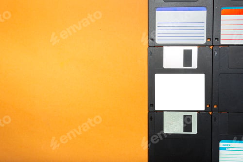 Preview: Floppy disks arranged on a plain orange background for retro tech display