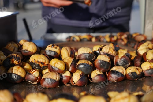 Preview: traditional Istanbul street food grilled chestnuts in a row