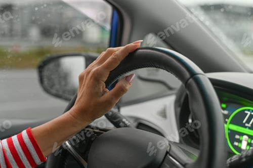 Preview: a woman is driving a car. concept