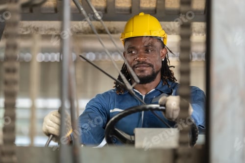 Preview: African american worker man wear safety helmet driver forklift warehouse in factory.