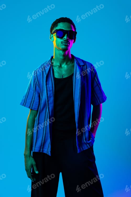Preview: African man portrait in studio on colorful background