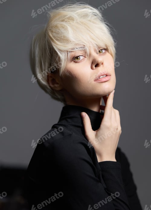 Preview: Stylish young woman with short platinum hair posing elegantly, wearing a black turtleneck