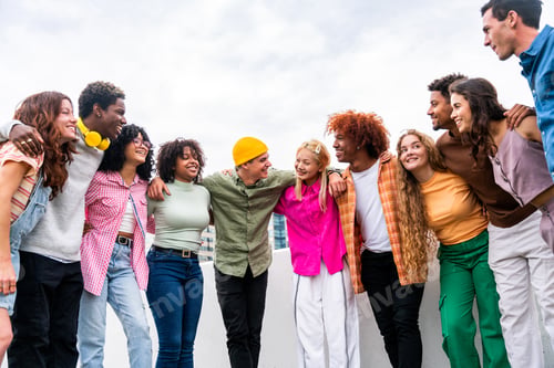 Preview: Happy playful multiethnic group of young friends bonding outdoors