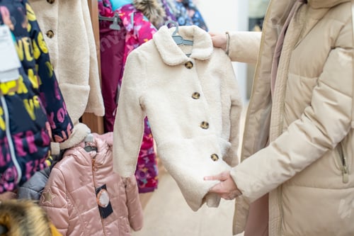 Preview: A woman looks at children's things in a store