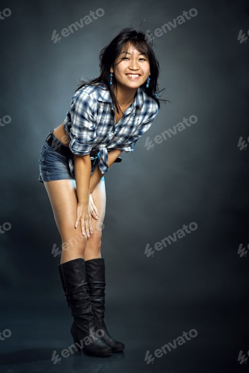 Preview: Smiling Asian Woman In Shirt And Shorts
