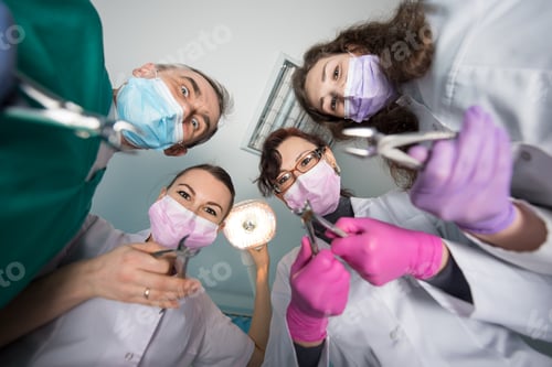 Preview: Professional dental team with removers at dental office. Dentistry