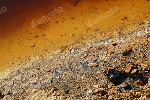Preview: Lake with polluted water and soil and with garbage on the shore.