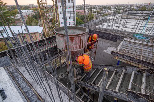 Preview: Workers on a building infrastructure roof with machinery and tools