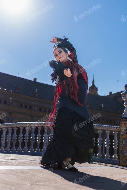 Preview: Flamenco dancer facing the camera while dance outdoors
