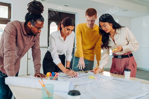 Preview: Multiracial team of engineers or architects having a meeting in an office