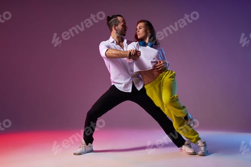 Preview: Beautiful couple performs latino dance with expression.