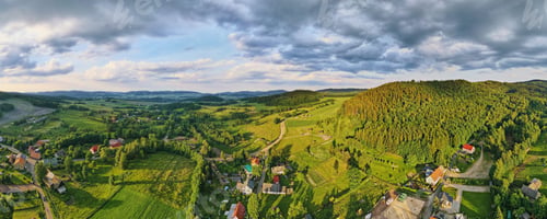 Preview: Aerial view of countryside area with village and mountains