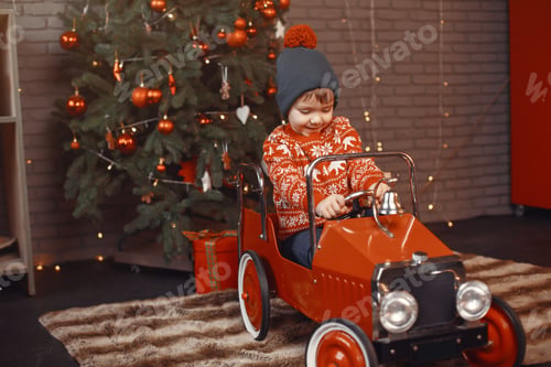 Preview: Cutte little boy at home near christmas decorations