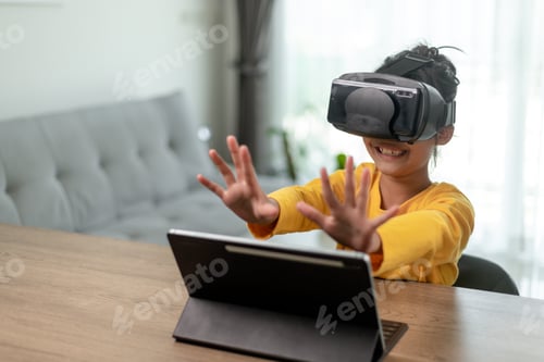 Preview: Cute girl wearing virtual reality googles at home, remote education experiment, future today,