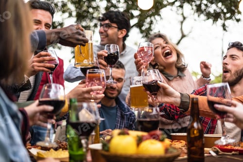 Preview: A diverse group of friends raising their glasses in a toast