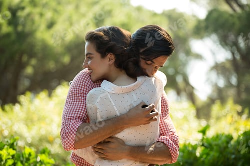 Preview: Affectionate couple embracing at park