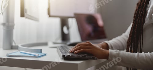 Preview: Close up shot of happy young woman working on computer, female hands typing on keyboard