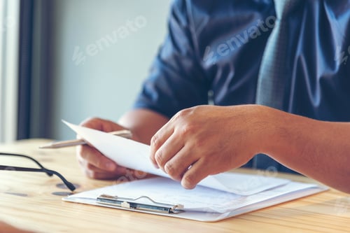 Preview: Businessman using smart digital tablet at office desk wireless internet technology working online
