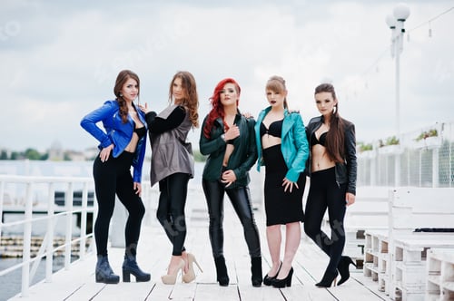 Preview: Group of sexy models girls in black bra and leather jackets on the dock