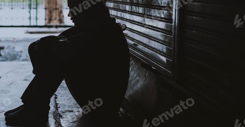Preview: Homeless Woman Sitting on The Street Side Hopeless