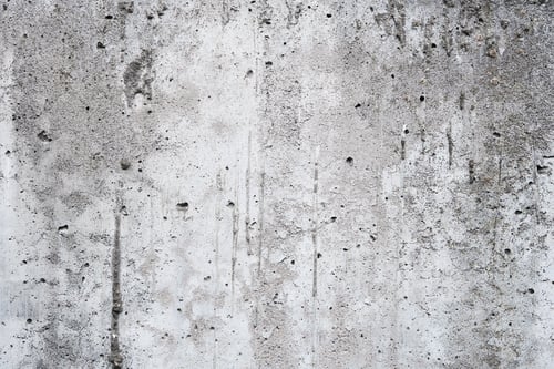 Preview: Cracked concrete wall covered with gray cement surface. Grey old wall with shabby damaged plaster or