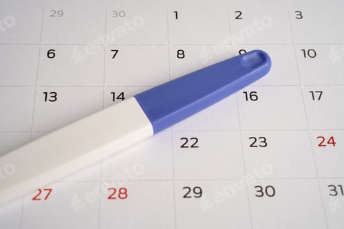 Preview: Pregnancy test on calendar, contraception health and medicine.