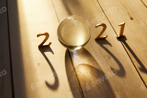 Preview: New Year 2021 Golden numbers 2021 with a crystal ball under the sunlight