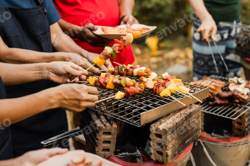 Preview: Skewers with colorful vegetables meat grilling, family friends gathering background, enjoying