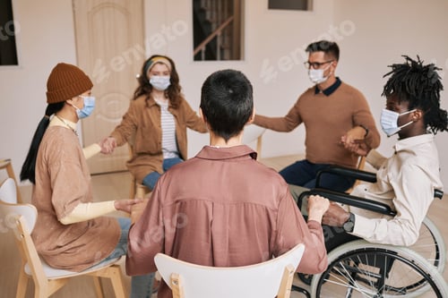 Preview: Holding Hands at Group Therapy Session