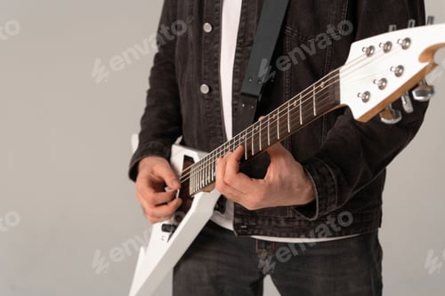 Preview: Man is holding a guitar