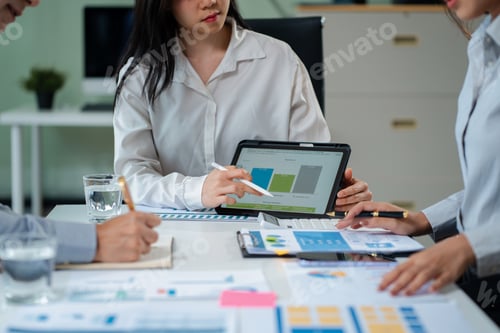 Preview: Businessmen write project ideas and use laptops to edit papers for brainstorming sessions