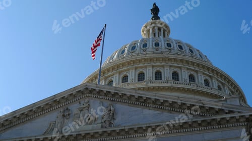 Preview: Capitol building in Washington DC, flag flying, a dome and statue.