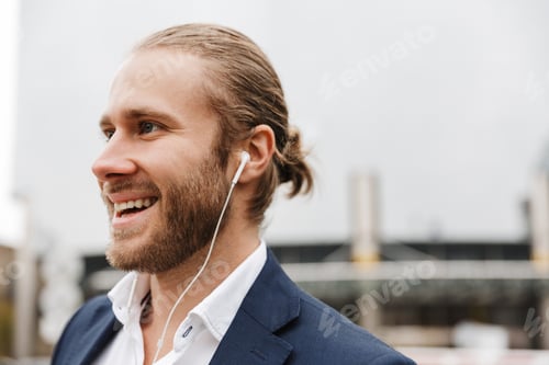 Preview: Smiling Man with Blonde Hair Listens to Music