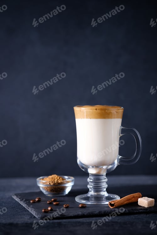 Preview: Whipped dalgona coffee with spices on dark background. Korean coffee drink. Vertical, copy space.