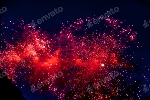 Preview: Holiday firework background. Fireworks with sparks, colored stars and bright nebula on black night