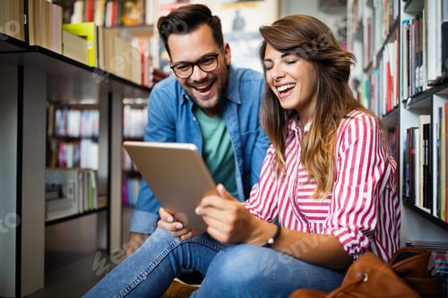 Preview: Group of college students studying in the school library