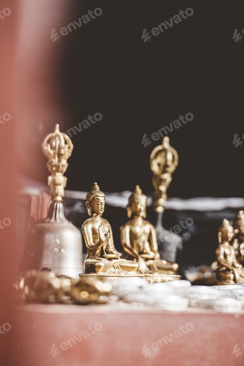 Preview: Selective focus shot of golden Buddha statue with a blurred background