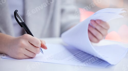 Preview: Shot of an unrecognizable businessperson going through paperwork at work