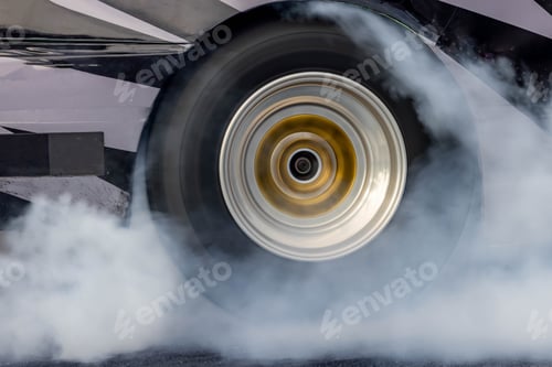 Preview: Car burnout wheels tire with white smoke,Car wheel burnout with smoke from the spinning tyre.
