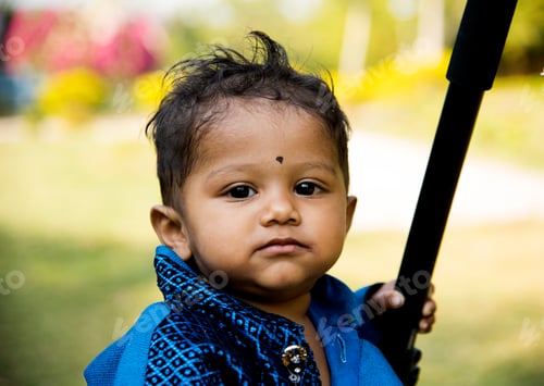 Preview: The one year old cute boy play in garden