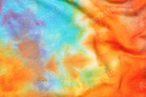 Preview: Close up of abstract tie dye multicolor folded knitted fabric cloth Boho pattern texture background