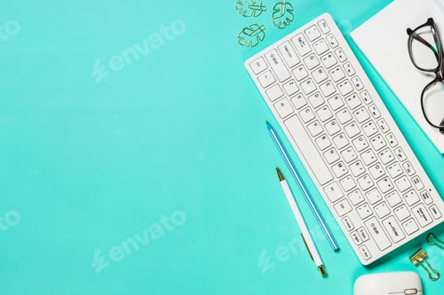 Preview: Office workplace with keyboard, notepad, glasses and pen