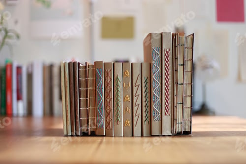 Preview: Small books on the wooden table background
