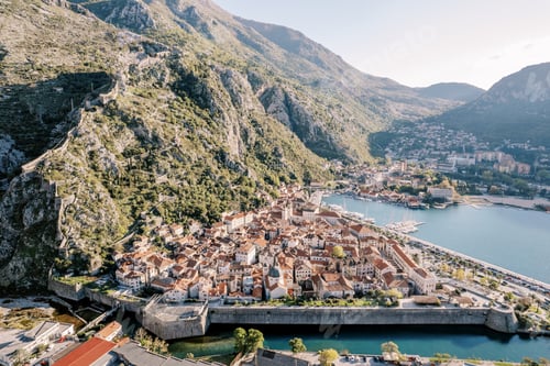 Preview: Ancient town on the shore of the bay surrounded by stone fortress walls. Kotor, Montenegro. Drone